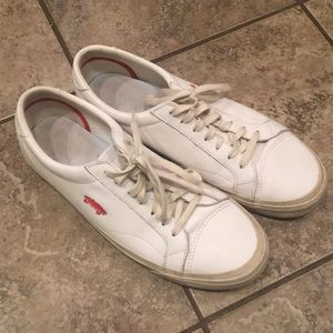White leather vans with embroidered logo
